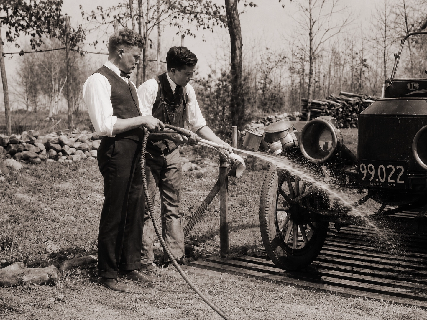 Two men washing an early automobile at Idylease in 1922