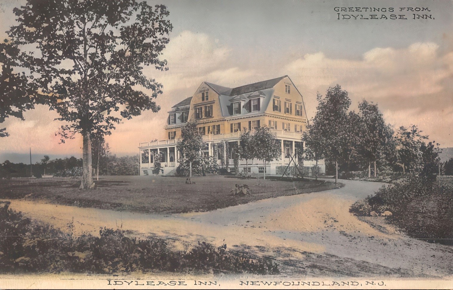 Hand-colored Idylease postcard titled First Glimpse of the Inn