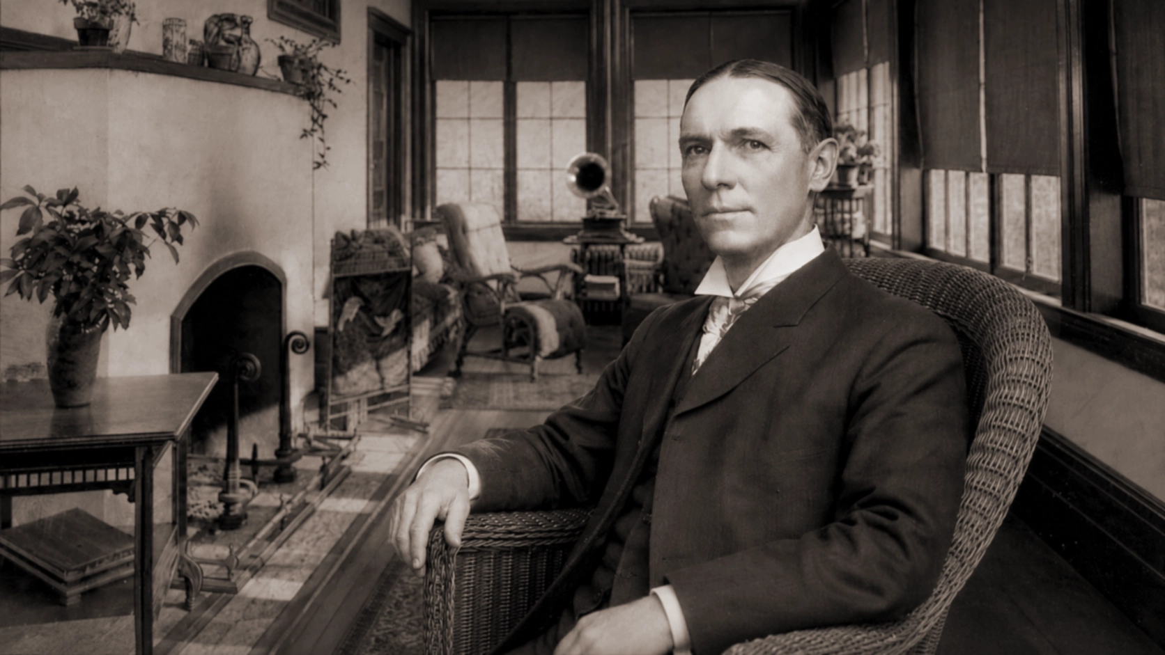Joseph French Johnson represented seated in the Idylease sun porch