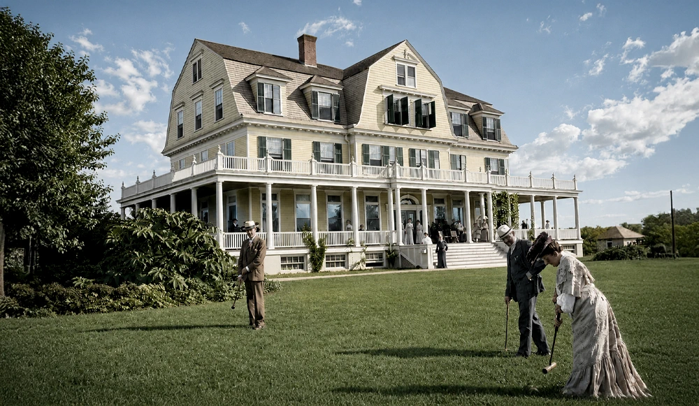 Dr. Edgar Day and his wife playing croquet on the Great Lawn in front of Idylease